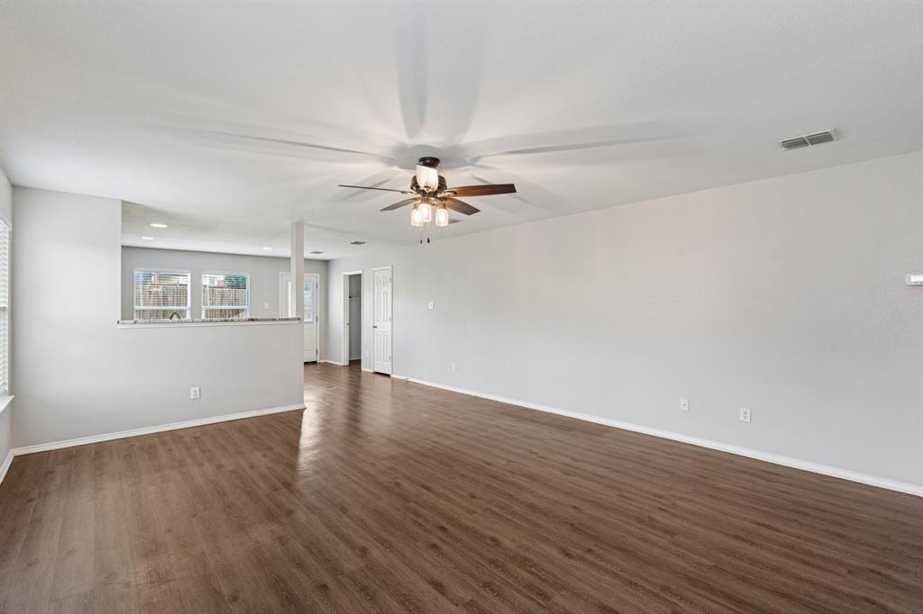 3005 Groveland Terrace Denton, TX 76210 - Photo 5 of 26 a view of an empty room with wooden floor