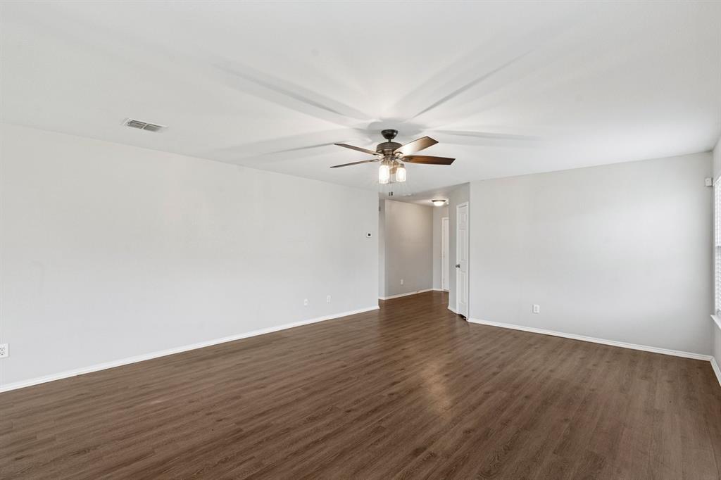 3005 Groveland Terrace Denton, TX 76210 - Photo 6 of 26 a view of an empty room with wooden floor