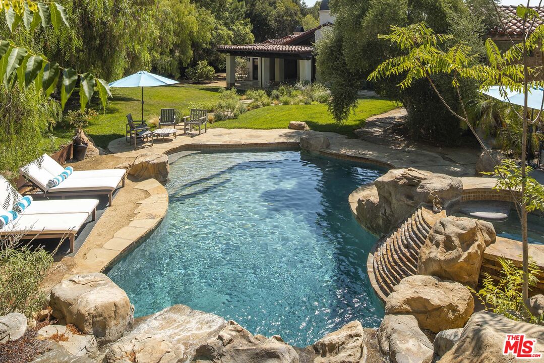 2251 Cold Canyon Road Calabasas, CA 91302 - Photo 30 of 47 a view of a backyard with plants and patio