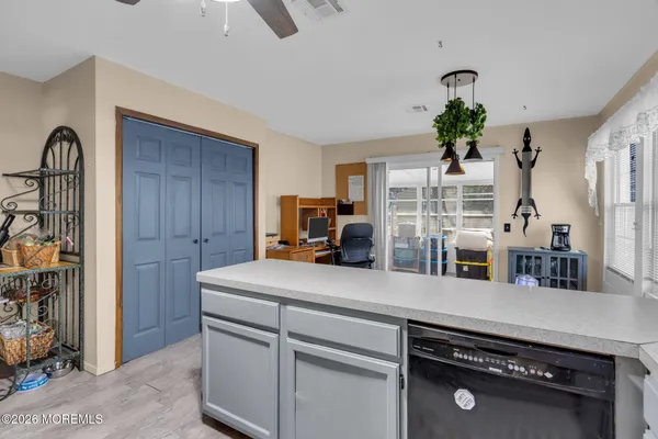 a kitchen with appliances cabinets and a counter top space