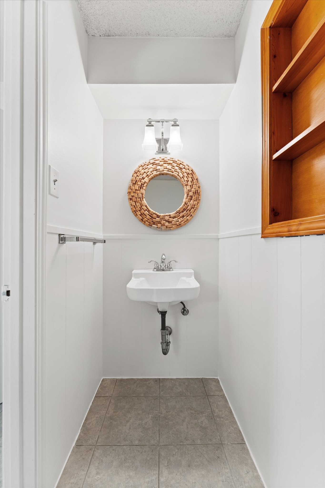 983 West Donovan Street Houston, TX 77091 - Photo 33 of 46 Half Bath off utility room, just inside back door, perfectly located for pool parties!