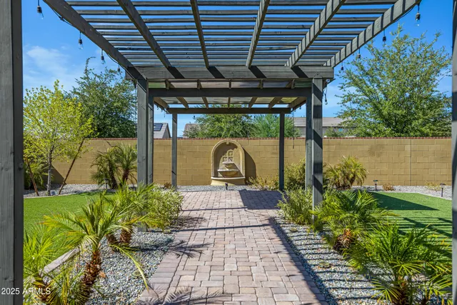 a porch with seating space and yard in the back