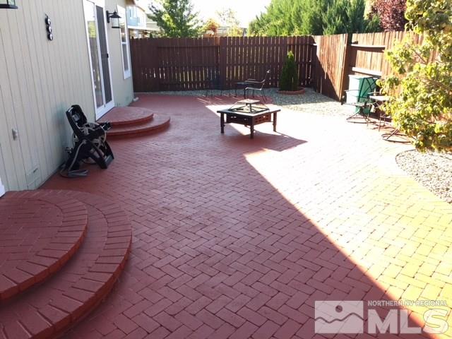 7687 Corso Street Reno, NV 89506 - Photo 6 of 24 a view of a backyard with sitting area