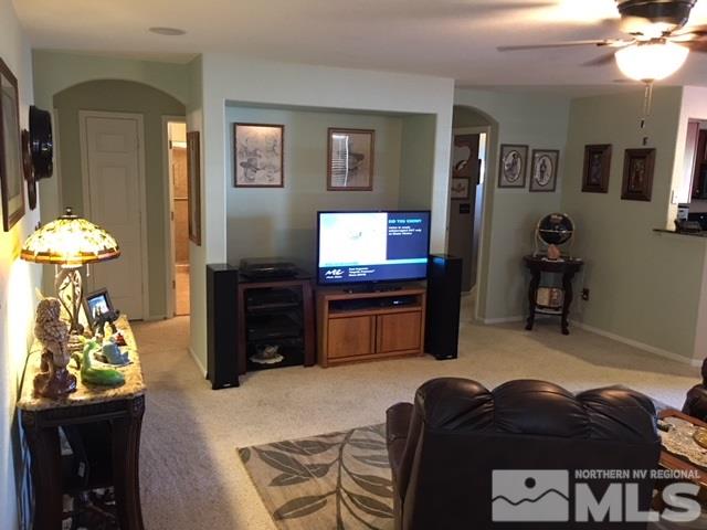 7687 Corso Street Reno, NV 89506 - Photo 8 of 24 a living room with furniture and a flat screen tv