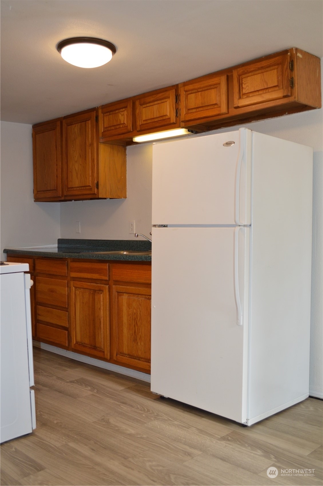 2707 Victor Place Everett, WA 98201 - Photo 24 of 30 a view of a storage & utility room with wooden floor