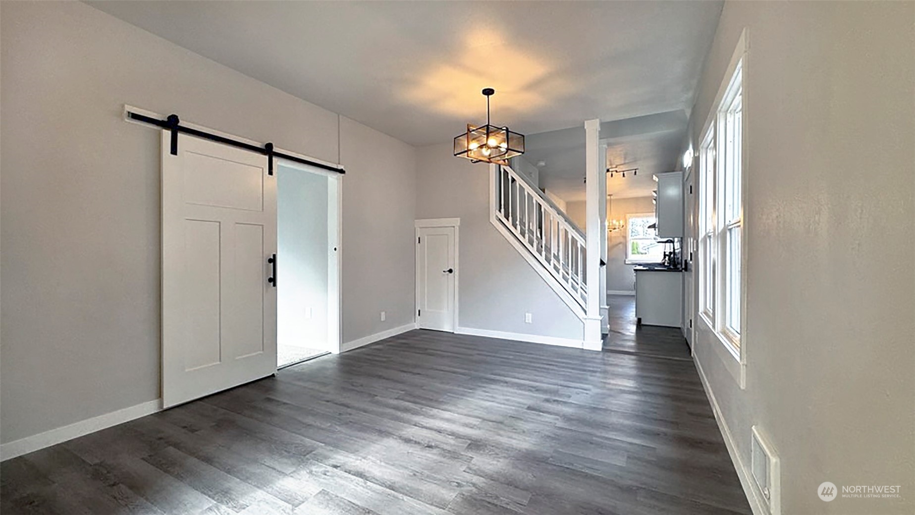 2707 Victor Place Everett, WA 98201 - Photo 4 of 30 a view of a hallway with wooden floor and staircase
