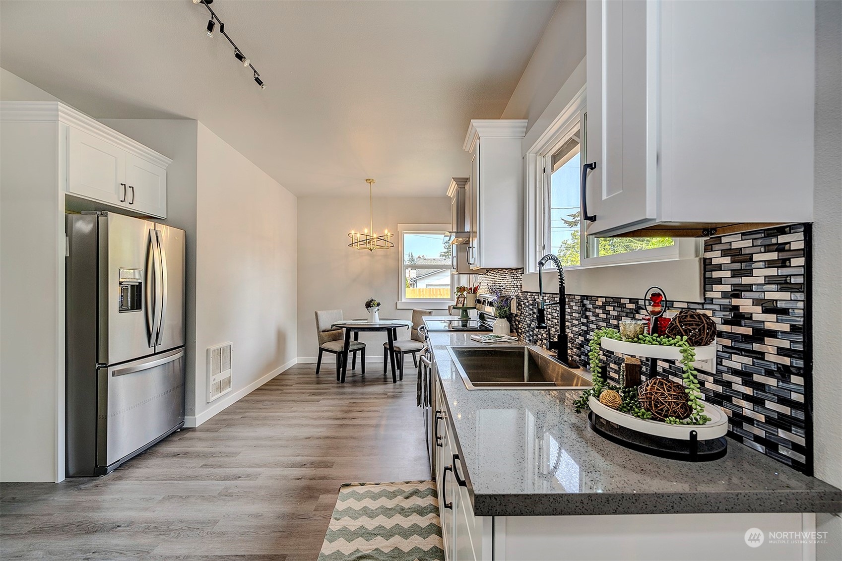 2707 Victor Place Everett, WA 98201 - Photo 5 of 30 a kitchen with stainless steel appliances kitchen island granite countertop a refrigerator and a sink