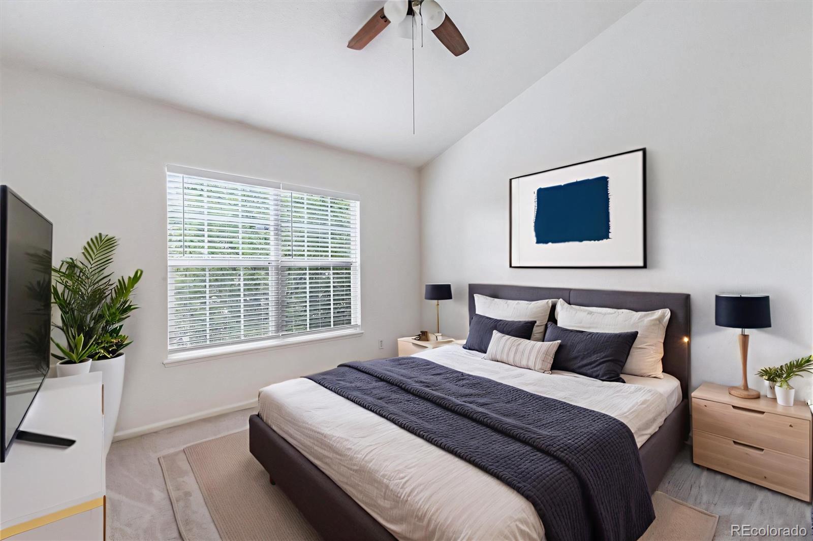260 West Jamison Circle, Unit 13 Littleton, CO 80120 - Photo 13 of 24 a bedroom with bed and window