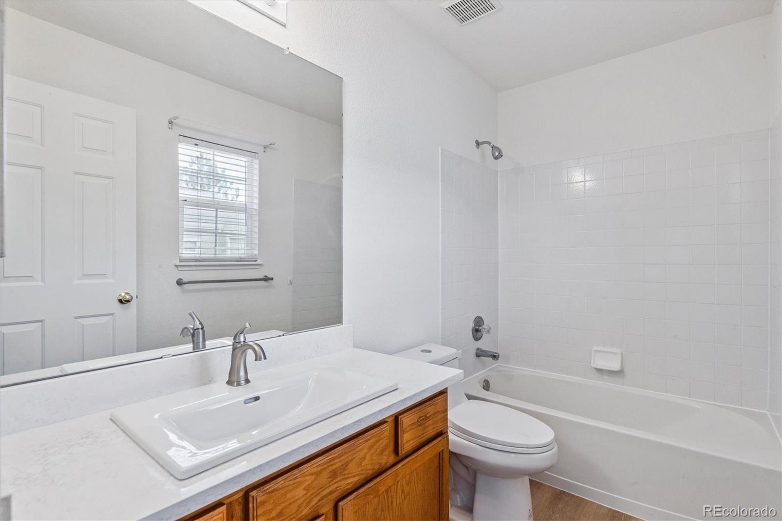 260 West Jamison Circle, Unit 13 Littleton, CO 80120 - Photo 18 of 24 a bathroom with a sink toilet and a bathtub