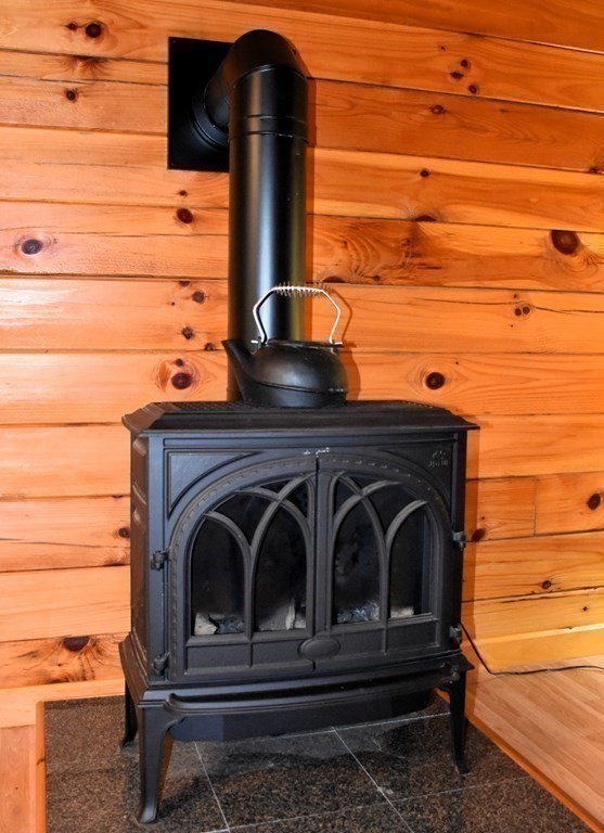 145 Baker Pond Road Dudley, MA 01571 - Photo 13 of 27 a view of backyard with wooden deck