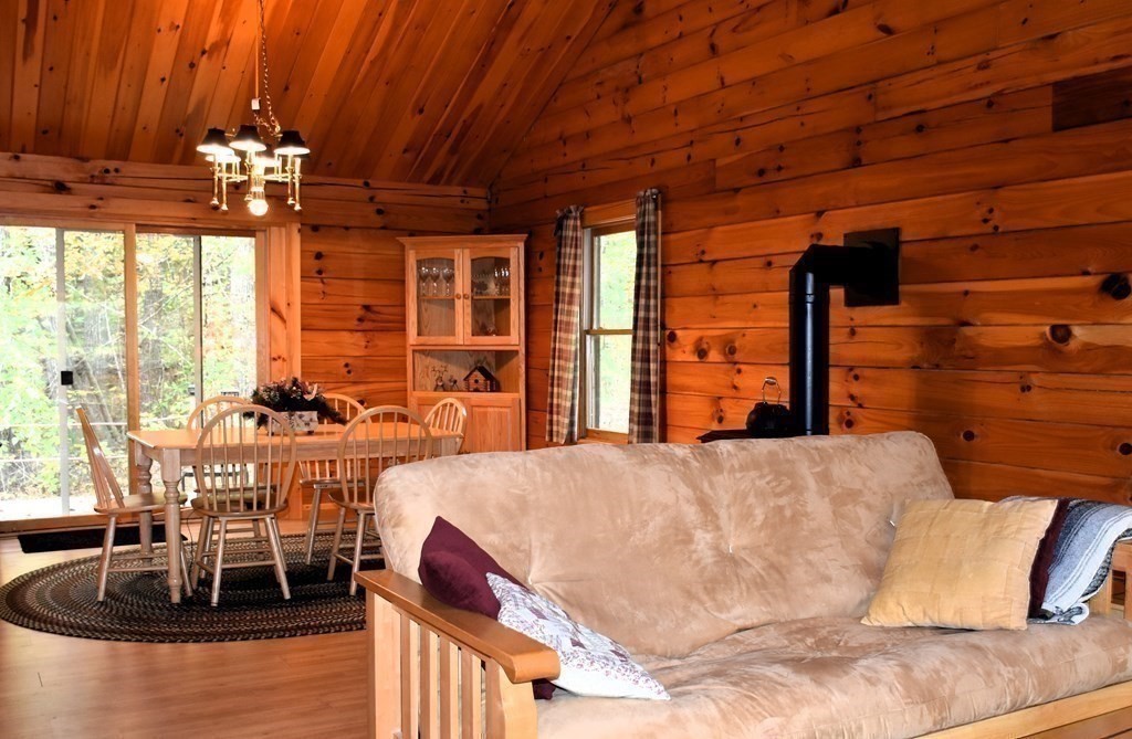 145 Baker Pond Road Dudley, MA 01571 - Photo 14 of 27 a view of a dining room with furniture window and outside view