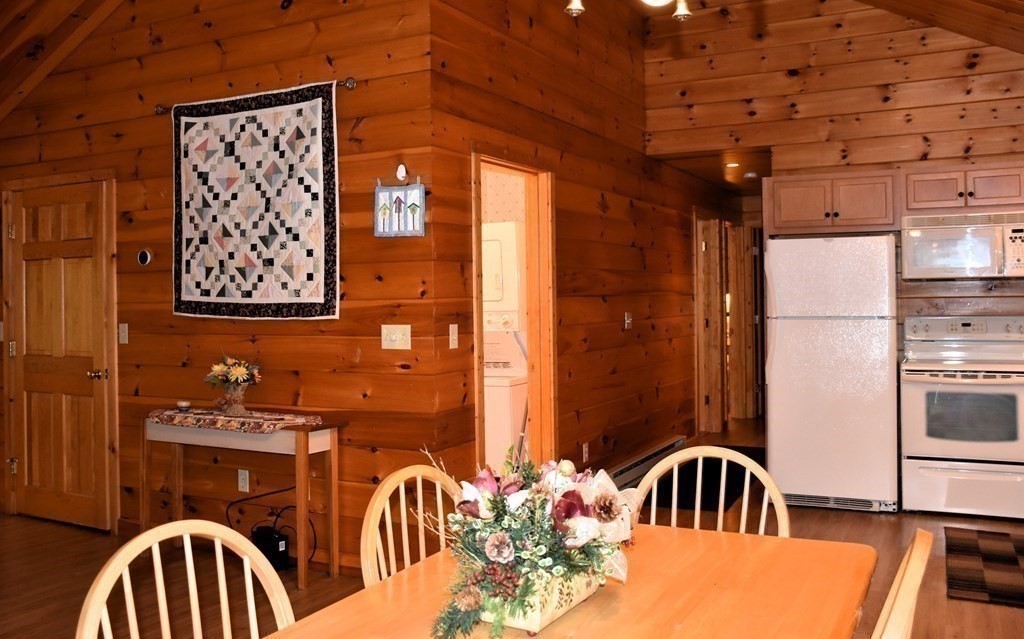 145 Baker Pond Road Dudley, MA 01571 - Photo 16 of 27 a view of a livingroom with furniture and entryway