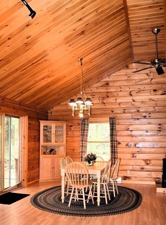 145 Baker Pond Road Dudley, MA 01571 - Photo 17 of 27 a view of a dining room with furniture window and wooden floor
