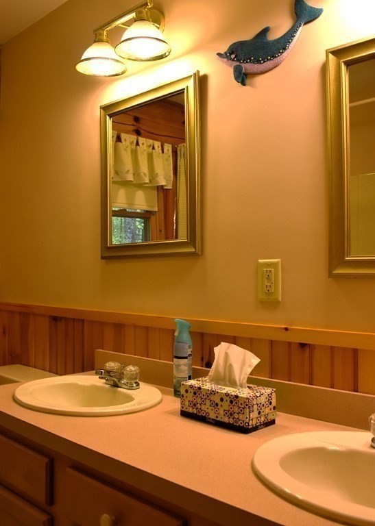 145 Baker Pond Road Dudley, MA 01571 - Photo 19 of 27 a bathroom with a granite countertop sink and a mirror