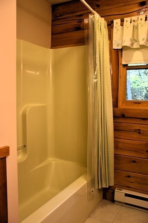145 Baker Pond Road Dudley, MA 01571 - Photo 20 of 27 a bathroom with a shower and a tub