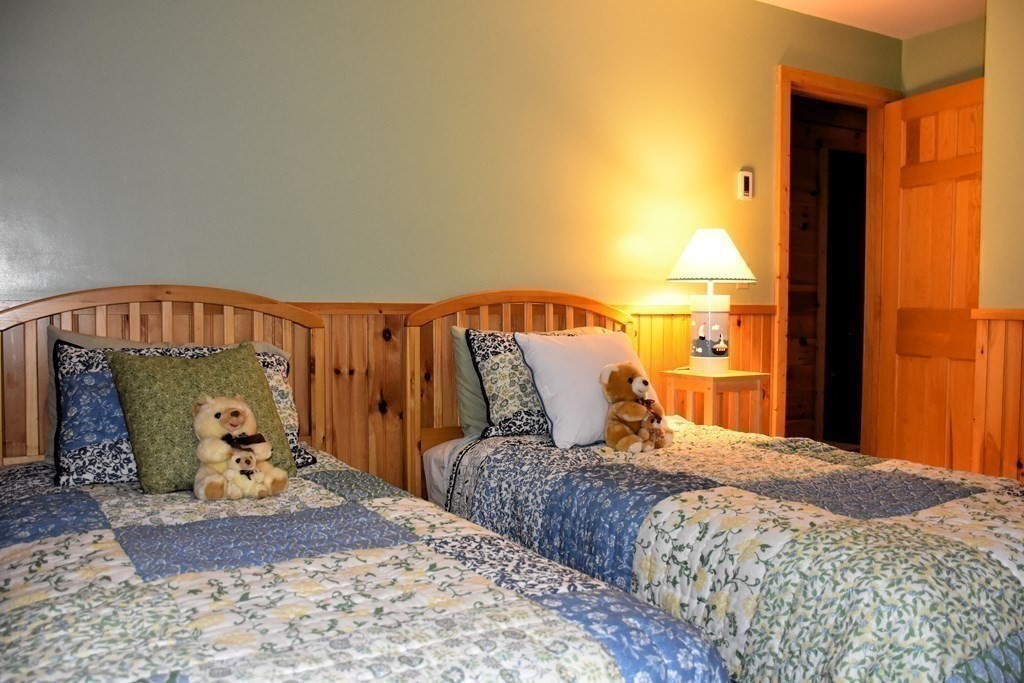 145 Baker Pond Road Dudley, MA 01571 - Photo 23 of 27 a bedroom with a large bed and a window