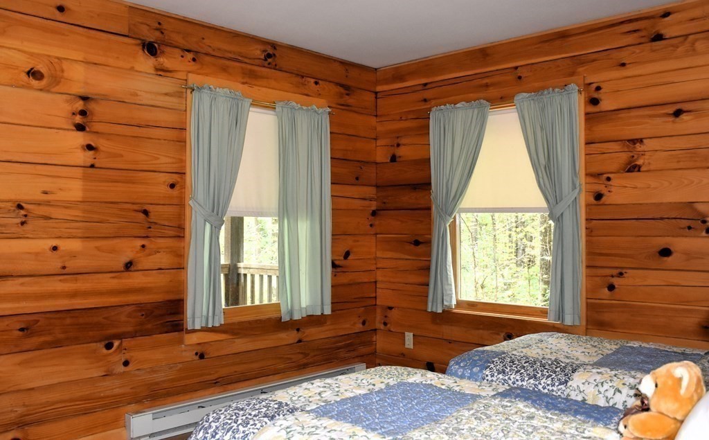 145 Baker Pond Road Dudley, MA 01571 - Photo 24 of 27 a bedroom with a bed and a window