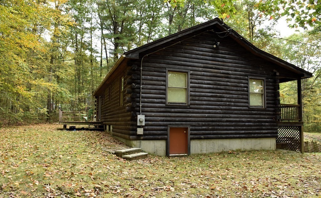 145 Baker Pond Road Dudley, MA 01571 - Photo 4 of 27 a front view of a house with a yard