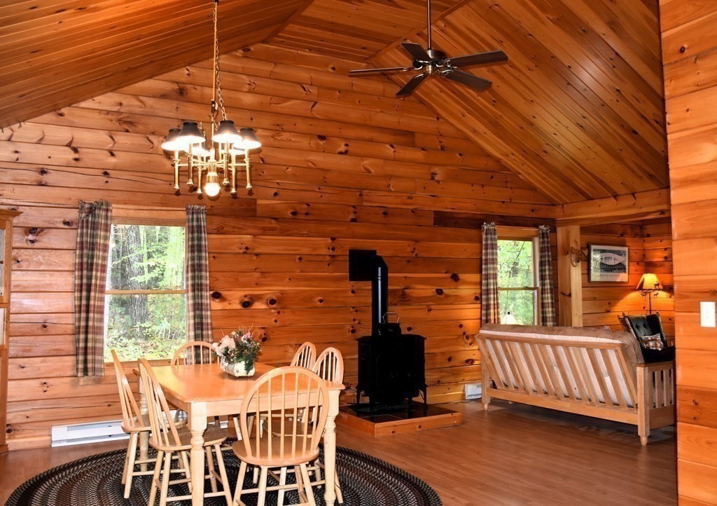 145 Baker Pond Road Dudley, MA 01571 - Photo 9 of 27 a view of a dining room with furniture and wooden floor