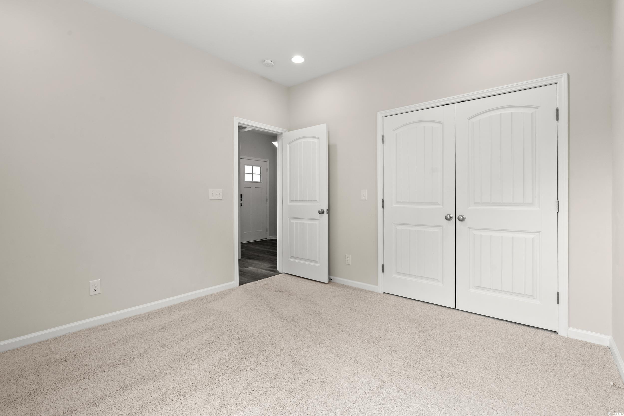 512 Charlton Boulevard Georgetown, SC 29440 - Photo 14 of 35 Unfurnished bedroom featuring carpet floors, baseboards, a closet, and recessed lighting