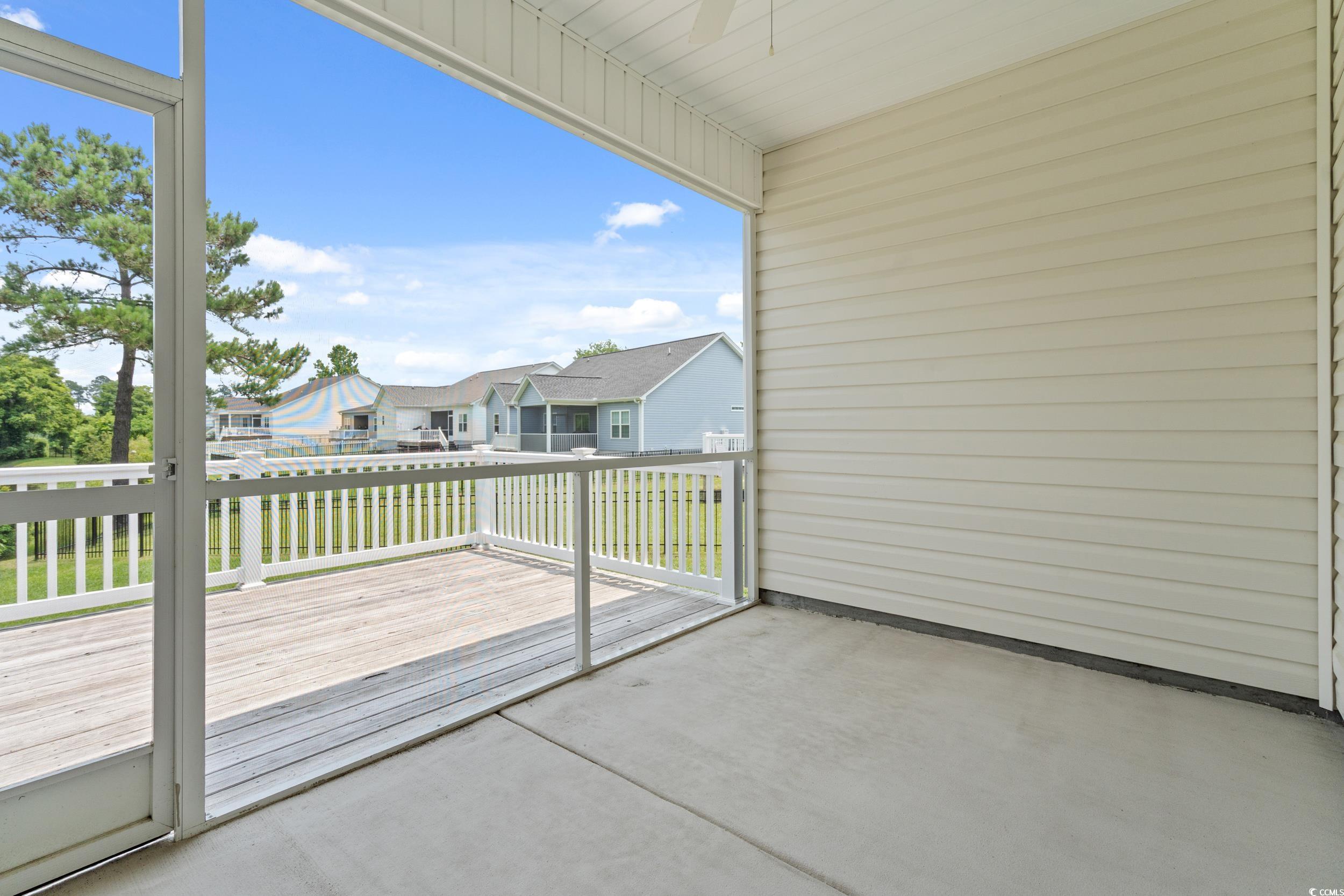 512 Charlton Boulevard Georgetown, SC 29440 - Photo 19 of 35 View of wooden balcony featuring a residential view, a deck, a patio, and ceiling fan