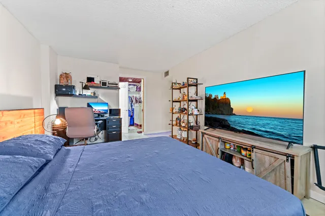 a bathroom with a toilet a sink and a mirror