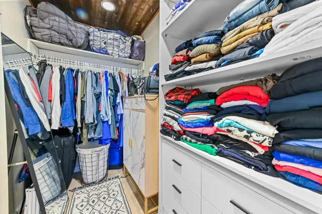 a white toilet sitting next to a bathroom sink