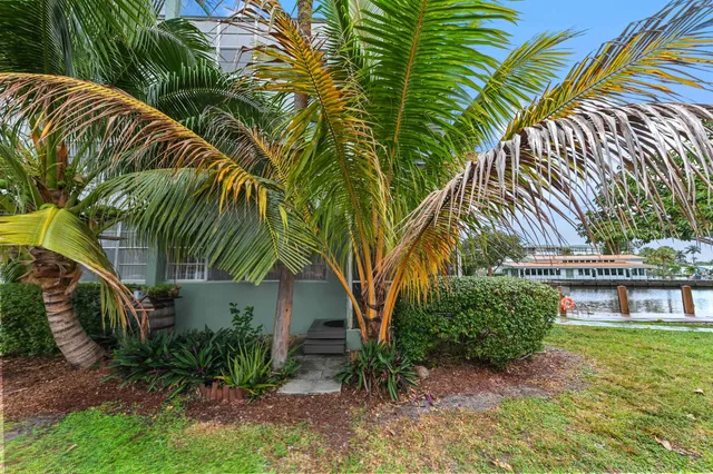 a view of swimming pool with outdoor seating and lake view