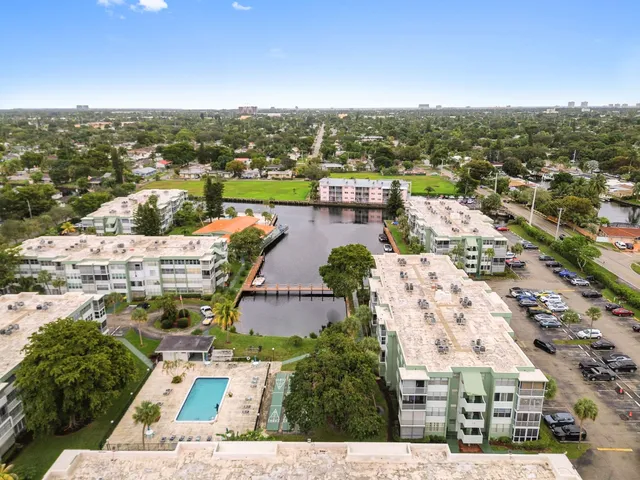 an aerial view of residential houses with outdoor space
