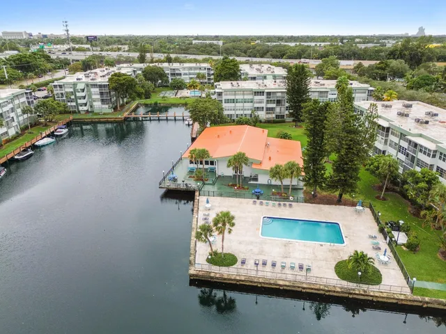 an aerial view of a house with a lake view