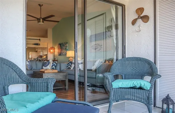 a outdoor living space with furniture and a rug