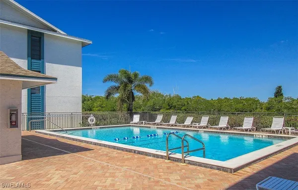 a view balcony with a swimming pool and outdoor space