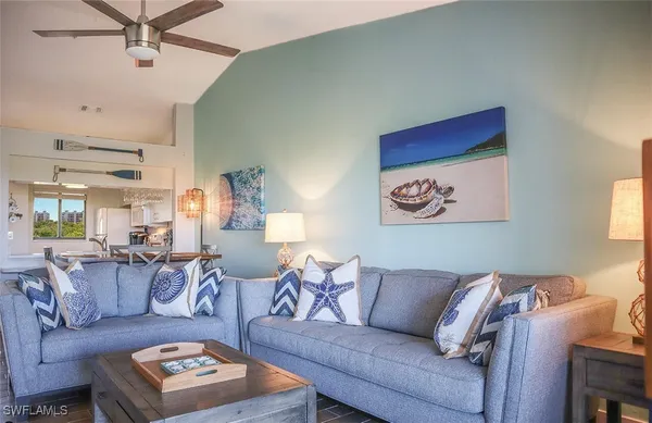 a living room with furniture and a rug