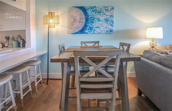 a view of a dining room with furniture and wooden floor