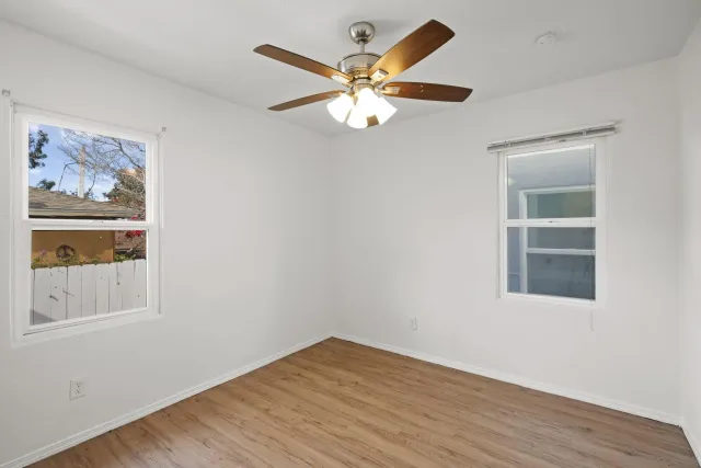 an aerial view of multiple houses with yard