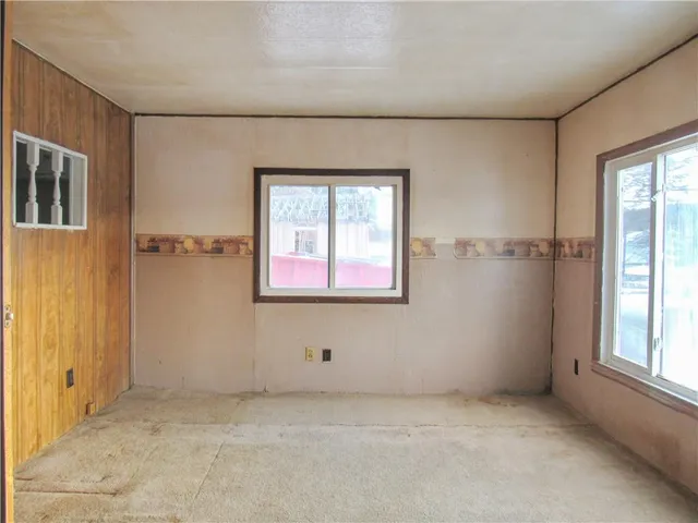 an empty room with windows