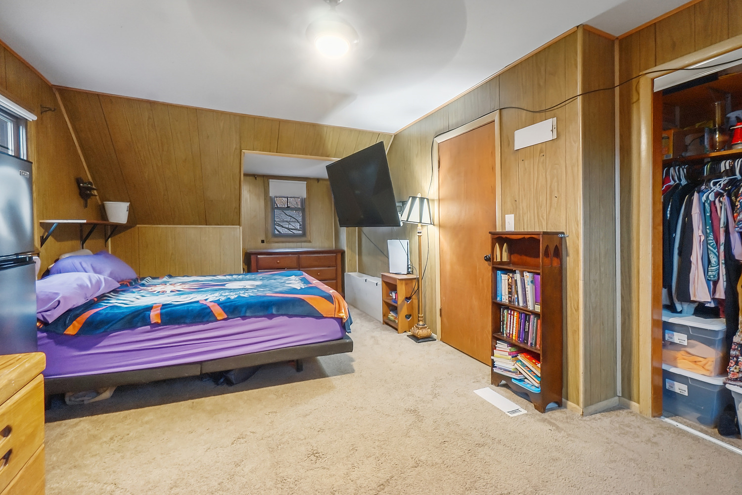 14317 Kilbourn Avenue Midlothian, IL 60445 - Photo 14 of 17 a bedroom with a bed and a book shelf