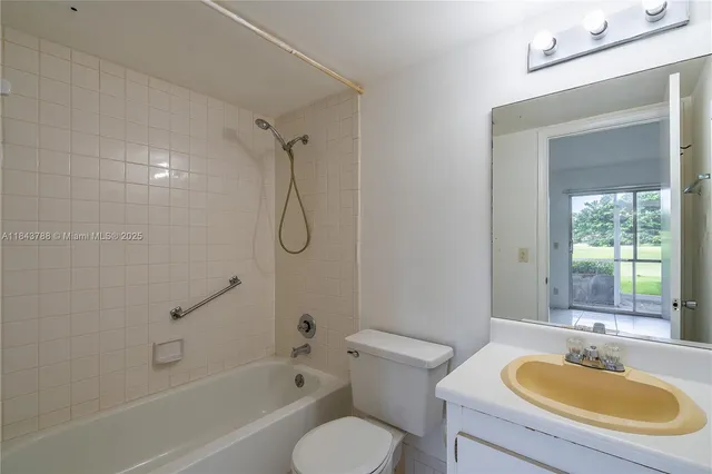 a bathroom with a sink toilet tub and shower