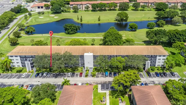 an aerial view of a house with outdoor space and lake view
