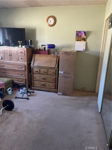 a room with furniture and a flat screen tv