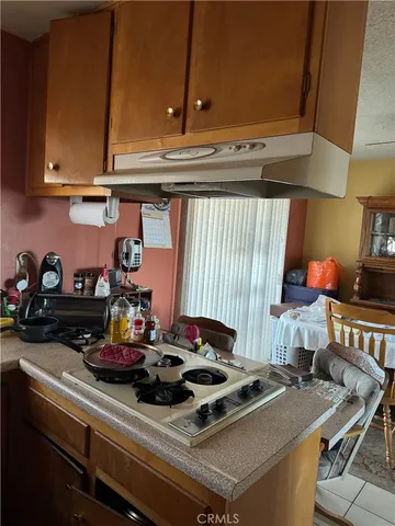 a kitchen with a stove and a microwave