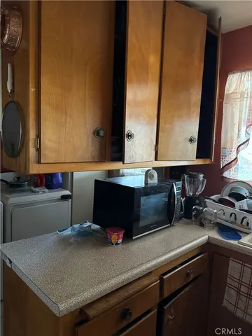 a kitchen with a sink and a stove top oven