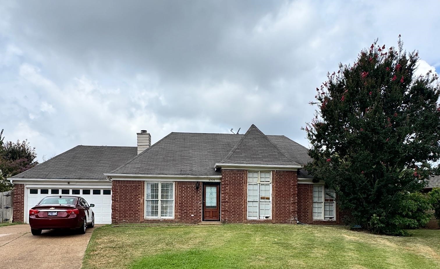 4709 Valene Circle Memphis, TN 38141 - Photo 1 of 23 a front view of a house with a garden