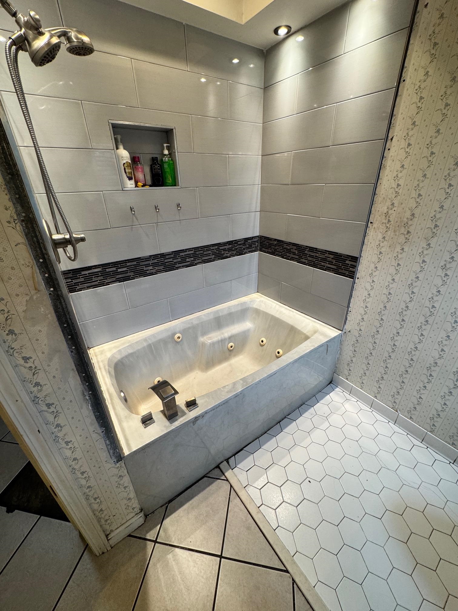 4709 Valene Circle Memphis, TN 38141 - Photo 13 of 23 a bath tub sitting next to a bathroom