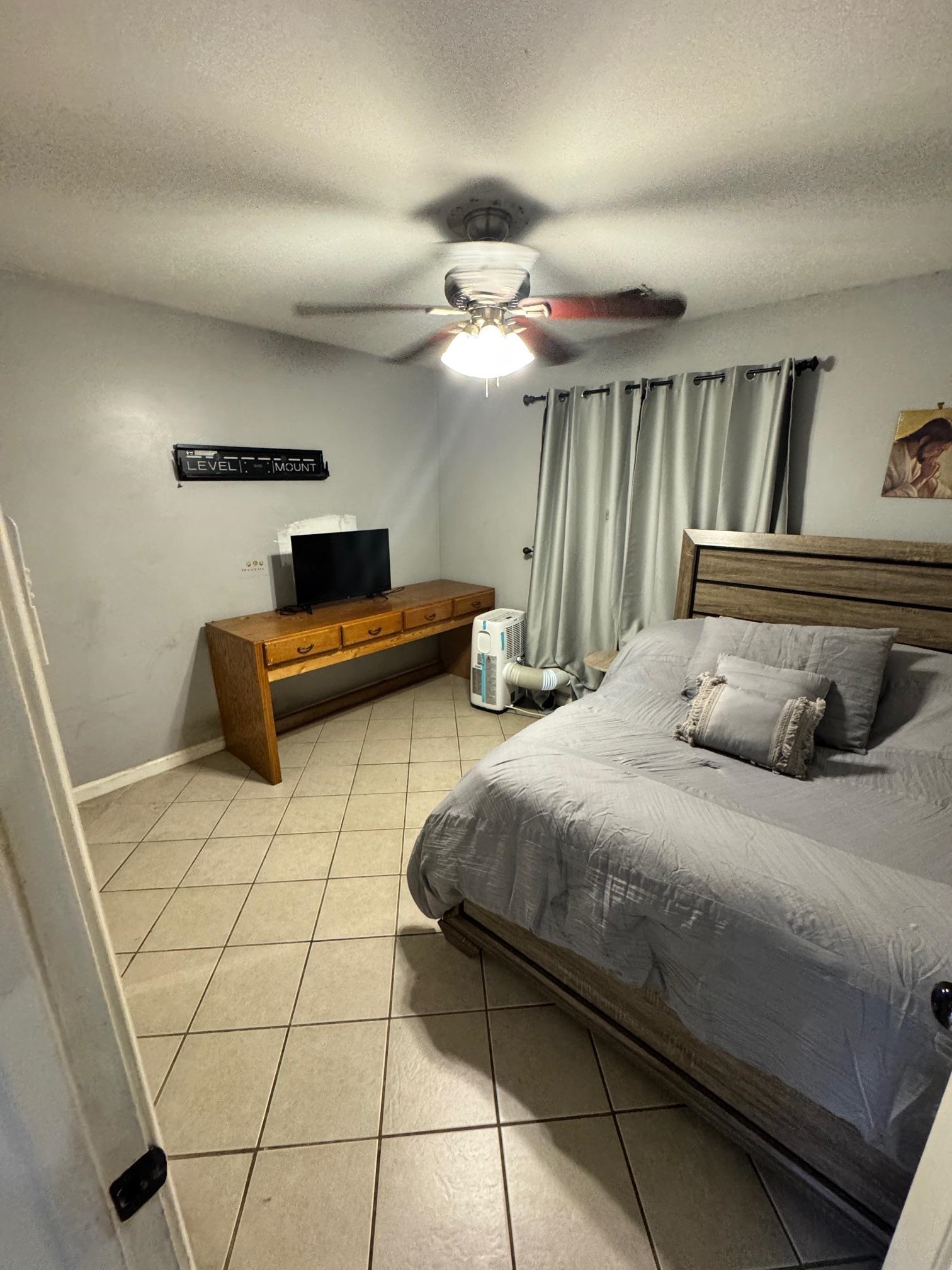 4709 Valene Circle Memphis, TN 38141 - Photo 16 of 23 a bedroom with a bed and a chandelier