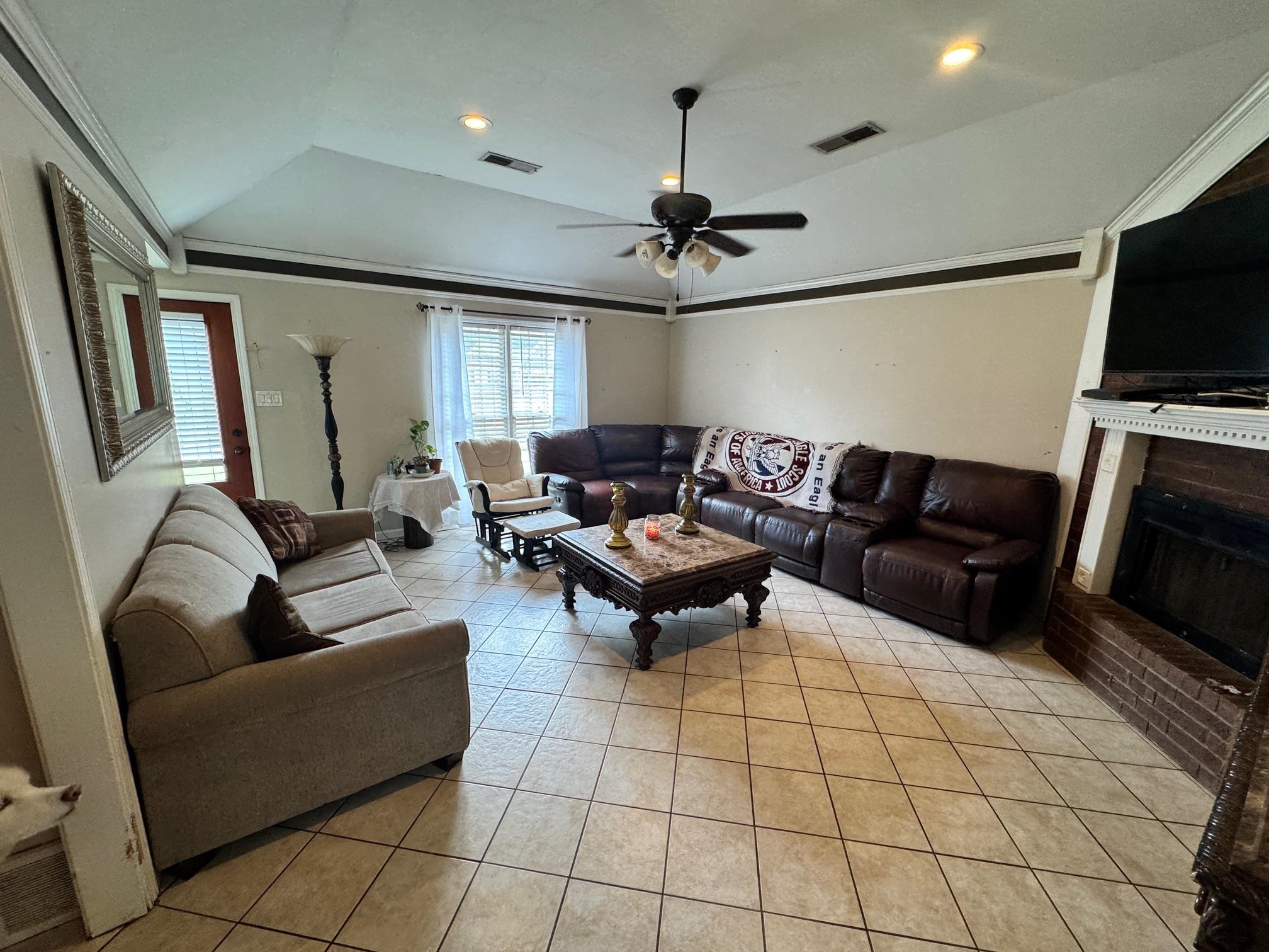 4709 Valene Circle Memphis, TN 38141 - Photo 4 of 23 a living room with furniture and a flat screen tv