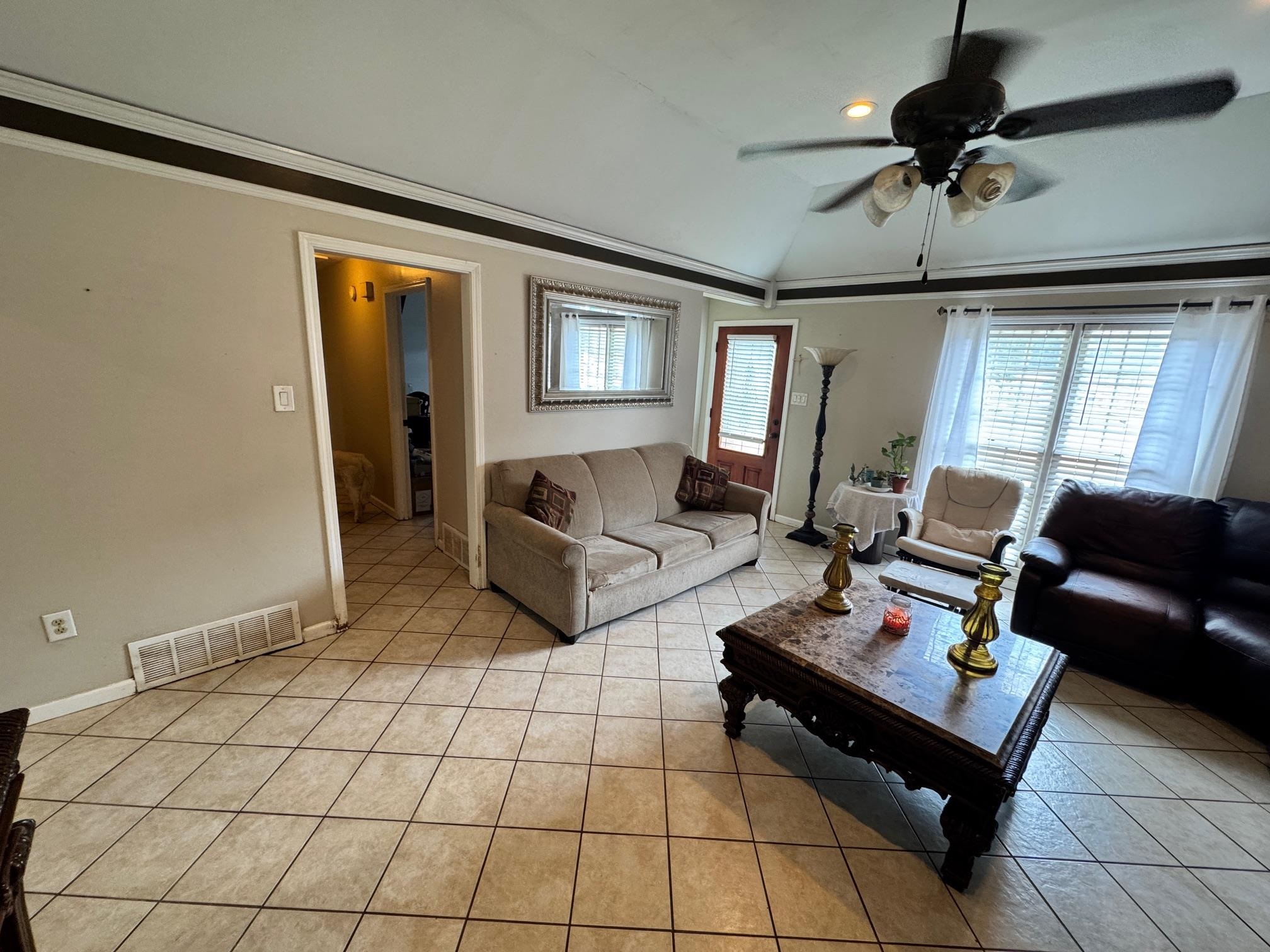 4709 Valene Circle Memphis, TN 38141 - Photo 5 of 23 a living room with furniture and a table
