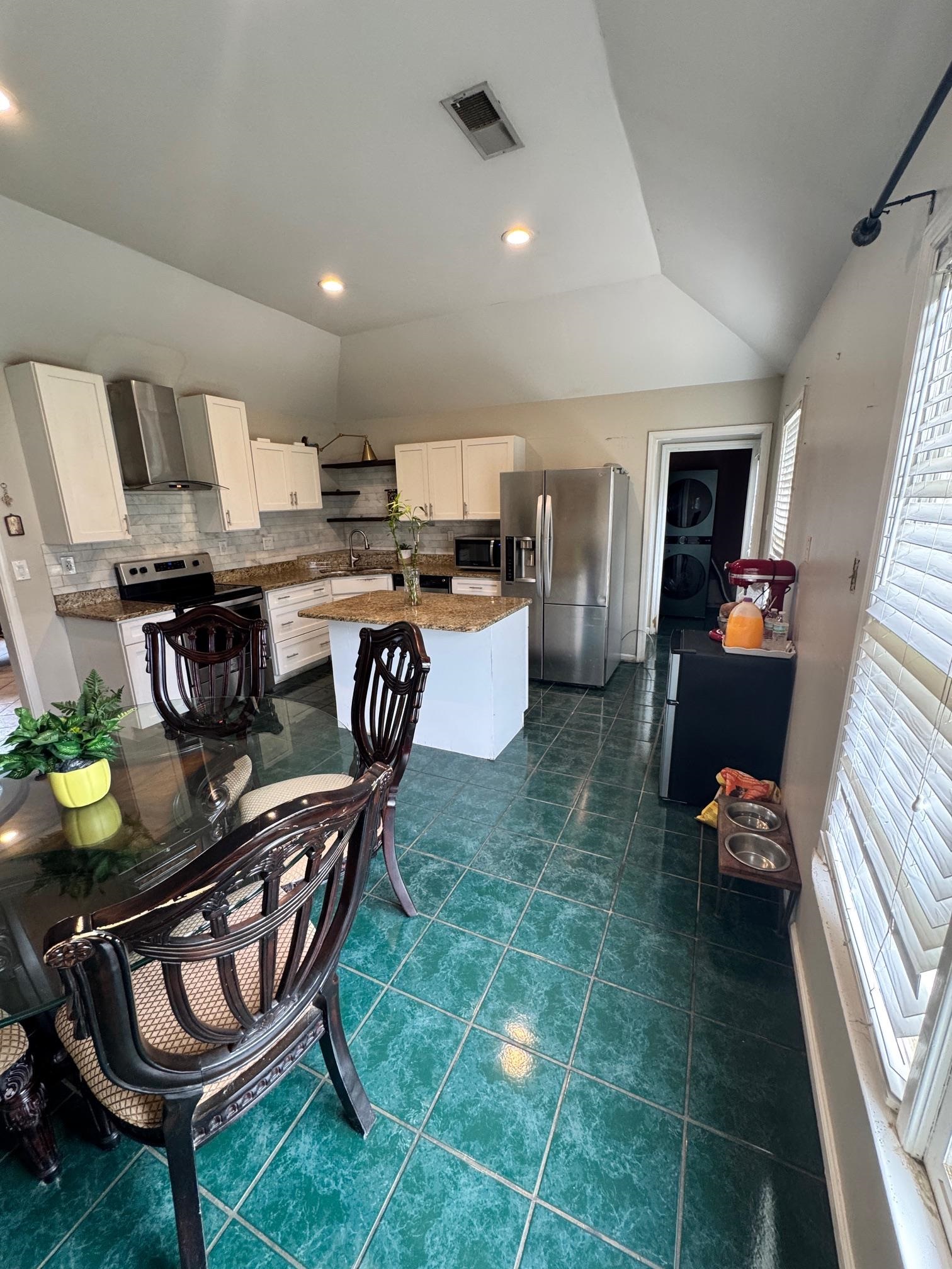 4709 Valene Circle Memphis, TN 38141 - Photo 7 of 23 a kitchen with a dining table and chairs