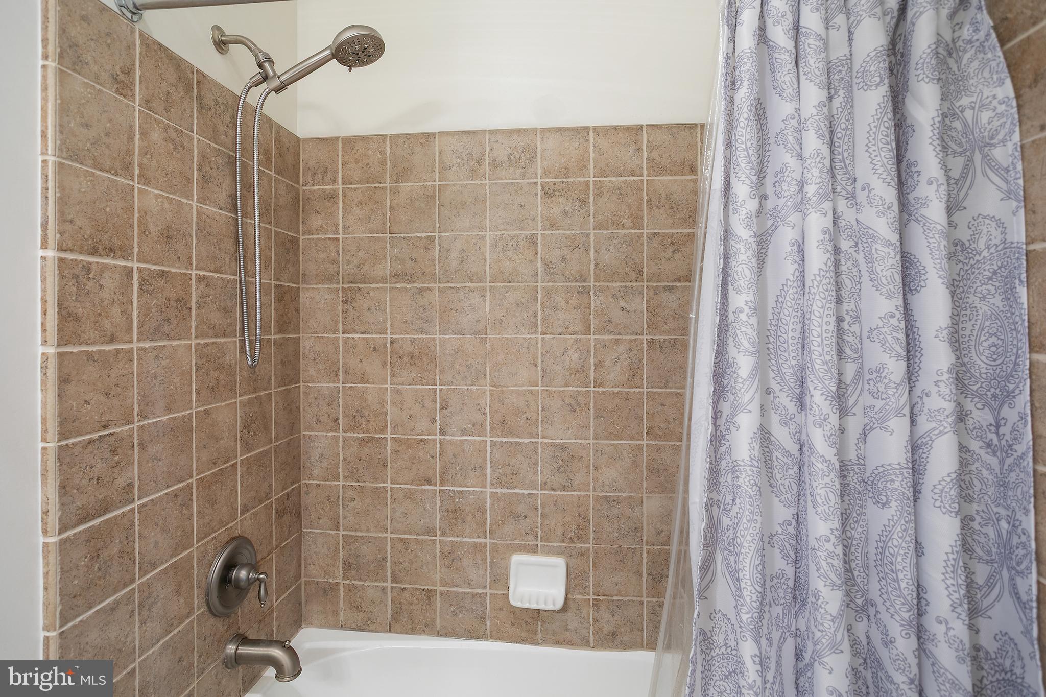 400 Cameron Station Boulevard, Unit 308 Alexandria, VA 22304 - Photo 13 of 46 a bathroom with a shower