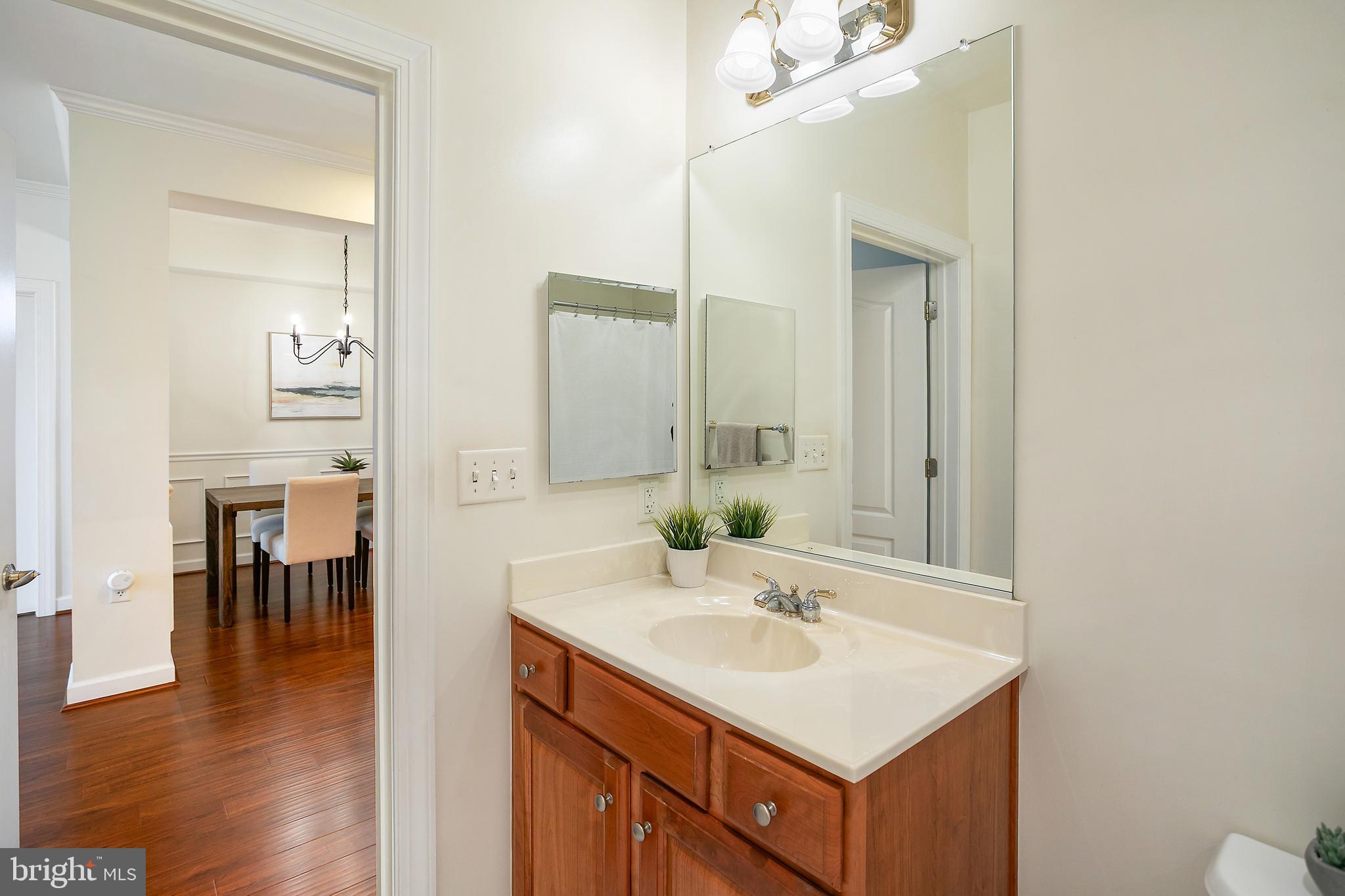 400 Cameron Station Boulevard, Unit 308 Alexandria, VA 22304 - Photo 18 of 46 a bathroom with a sink vanity and a mirror